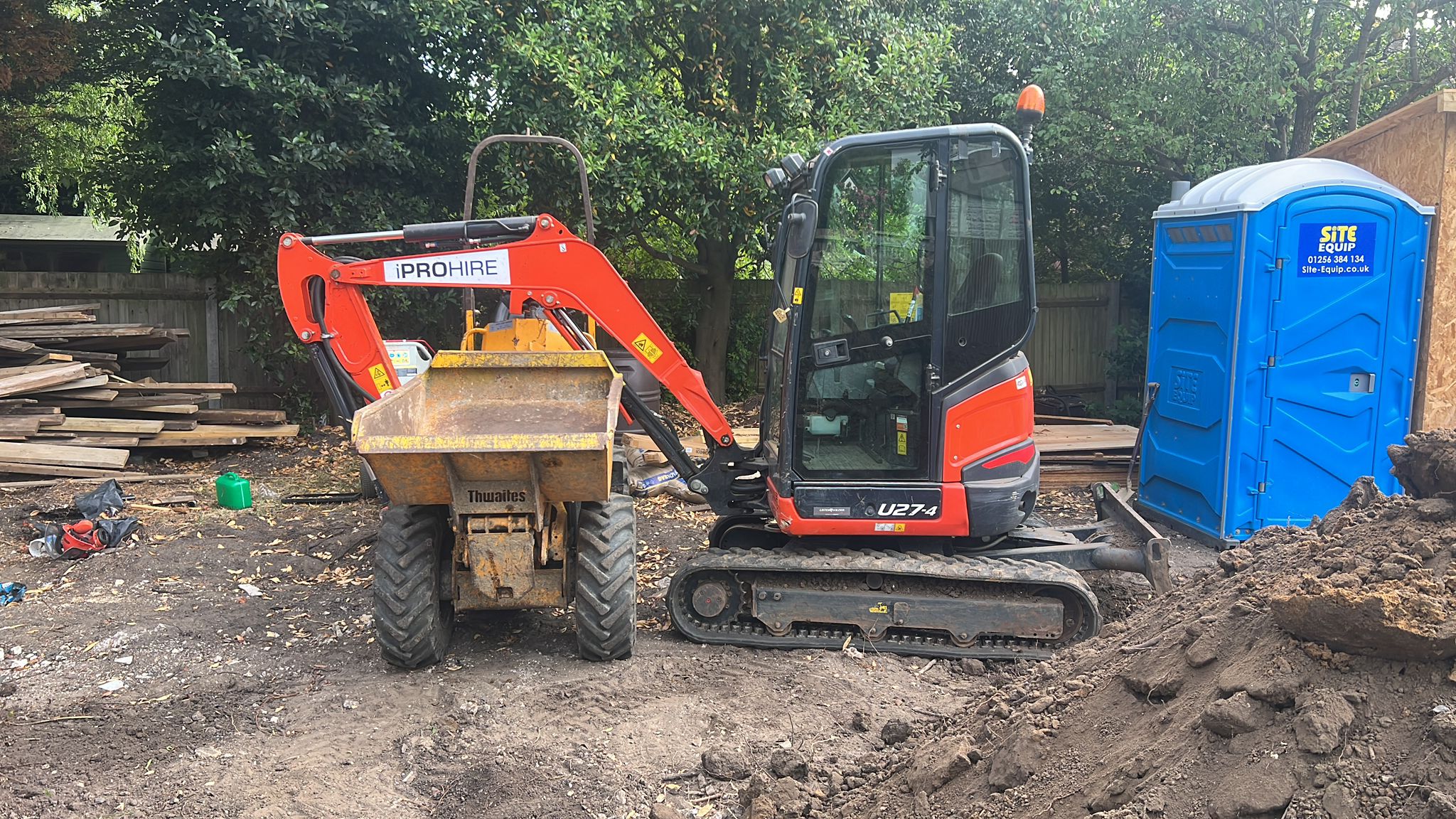 Mini digger operator working in Edgware